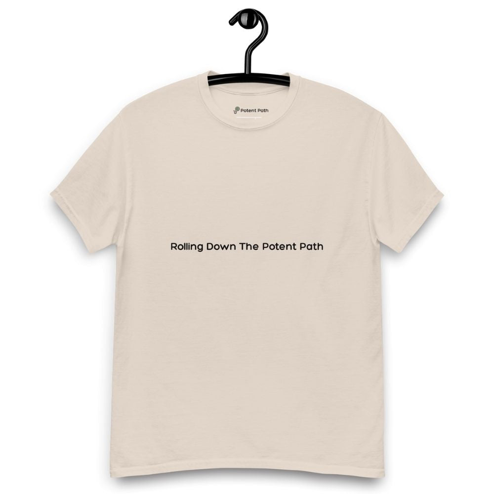 Beige t-shirt on a hanger, featuring centred black text that reads 'Rolling Down The Potent Path'