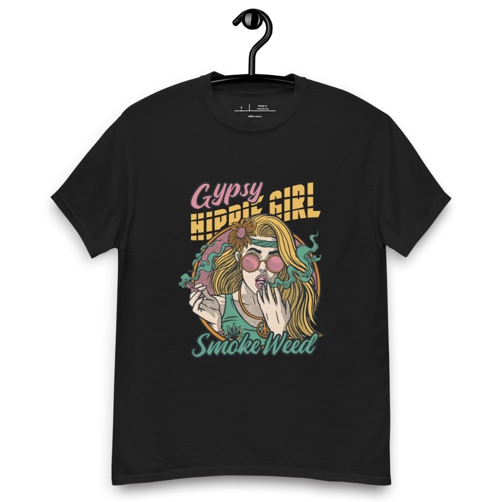 Black T-shirt on a hanger featuring a colourful illustration of a woman with long blonde hair, round pink sunglasses, and a flower in her hair, smoking weed with swirling smoke around her and text "Gypsy Hippie Girl" above and "Smoke Weed" below