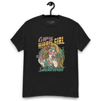 Black T-shirt on a hanger featuring a colourful illustration of a woman with long blonde hair, round pink sunglasses, and a flower in her hair, smoking weed with swirling smoke around her and text "Gypsy Hippie Girl" above and "Smoke Weed" below