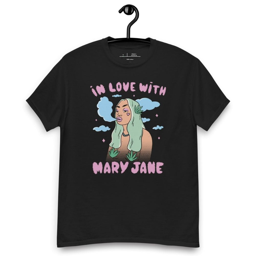 Black T-shirt on a hanger featuring a cartoon woman with long green hair, cannabis leaves covering her breasts and smoke clouds behind her, with the text "IN LOVE WITH MARY JANE" above and "MARY JANE" below the illustration