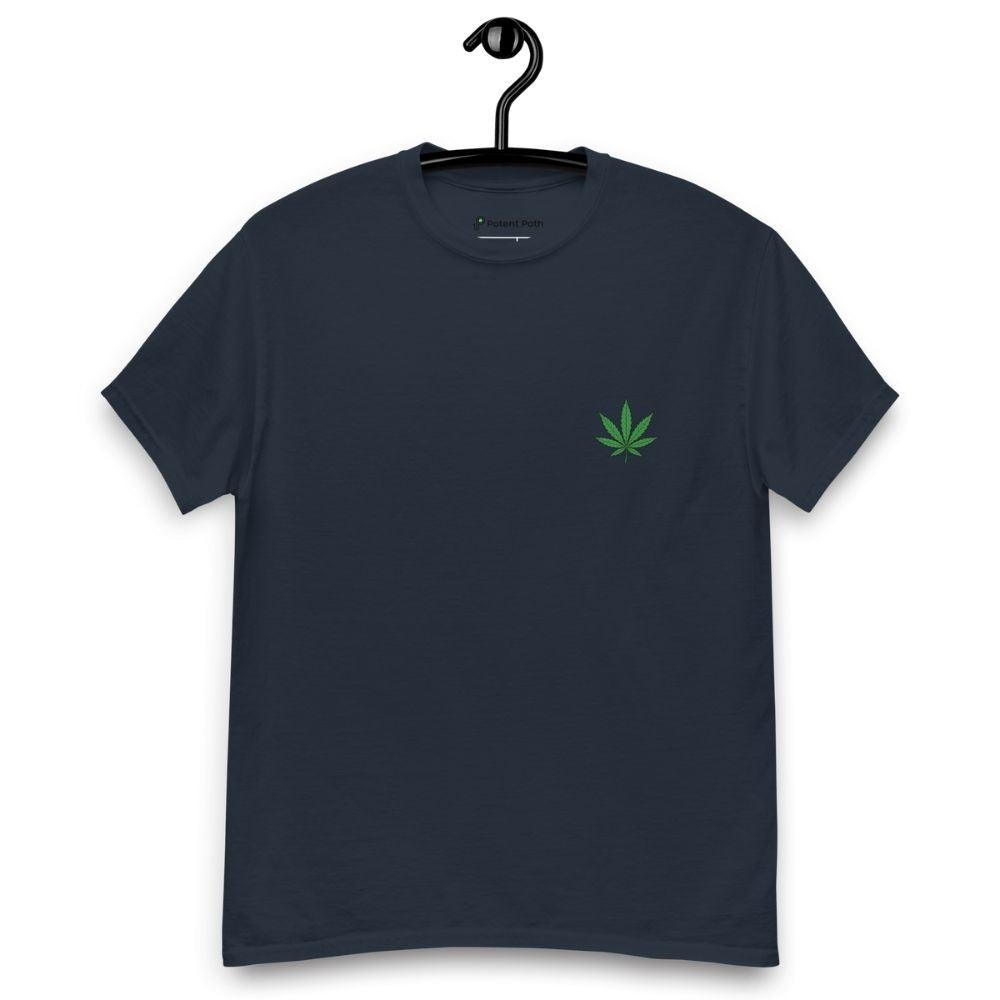 Black t-shirt with a green leaf design on a hanger against a white background
