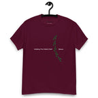 Burgundy t-shirt on a hanger featuring the phrase "Walking The Potent Path Slowly" in white text across the chest, with a vertical trail of small green footprints with cannabis leaves inside between "Path" and "Slowly"