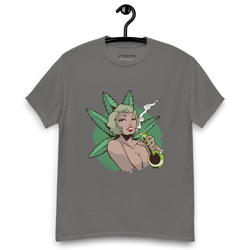Charcoal grey T-shirt on a hanger featuring a graphic on the chest of a pin-up style woman smoking a joint, framed by large green cannabis leaves