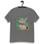 Charcoal grey T-shirt on a hanger featuring a graphic on the chest of a pin-up style woman smoking a joint, framed by large green cannabis leaves