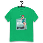 Green T-shirt on a hanger featuring a retro-style illustration of a woman in a teal dress holding a smoking joint, next to the text “TODAY'S GOOD MOOD IS SPONSORED BY Weed"