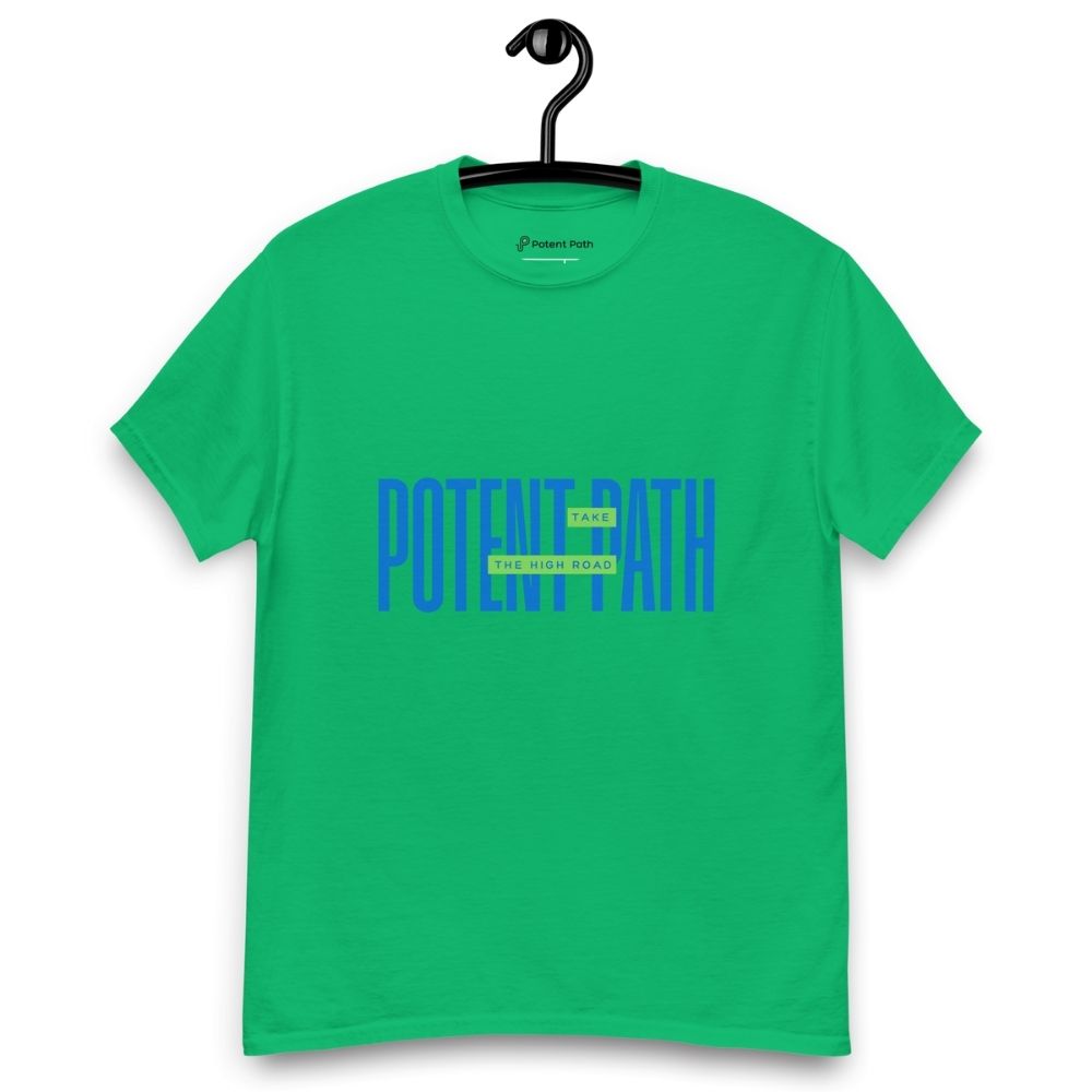 Green t-shirt on a hanger featuring large blue text that reads "POTENT PATH," with a small green overlay in the centre containing the words "TAKE THE HIGH ROAD"
