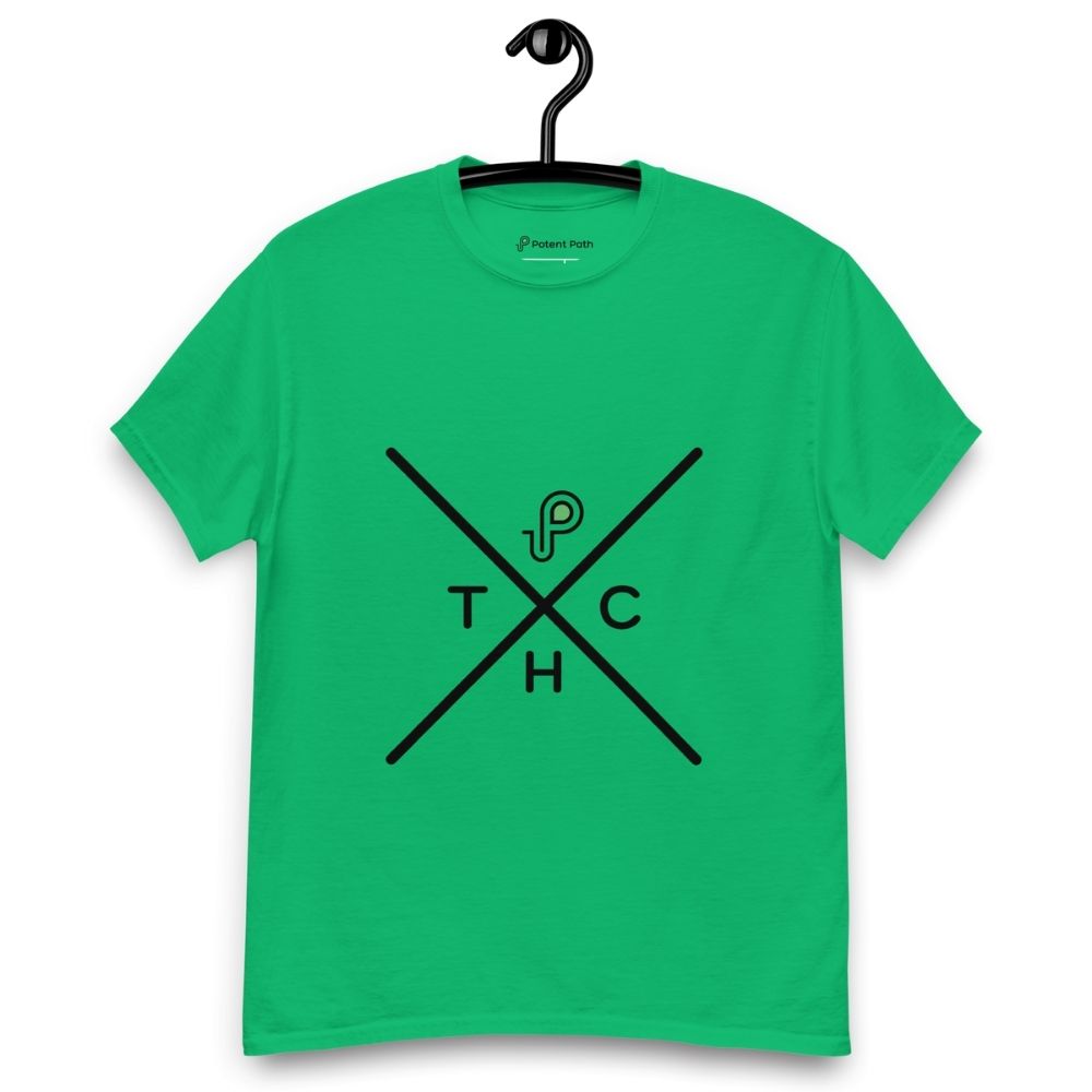 Green t-shirt on a hanger featuring a minimalist crossed-line design with the letters T, H, C, arranged in the quadrants, and a small green-and-black "P" logo positioned above the centre of the cross