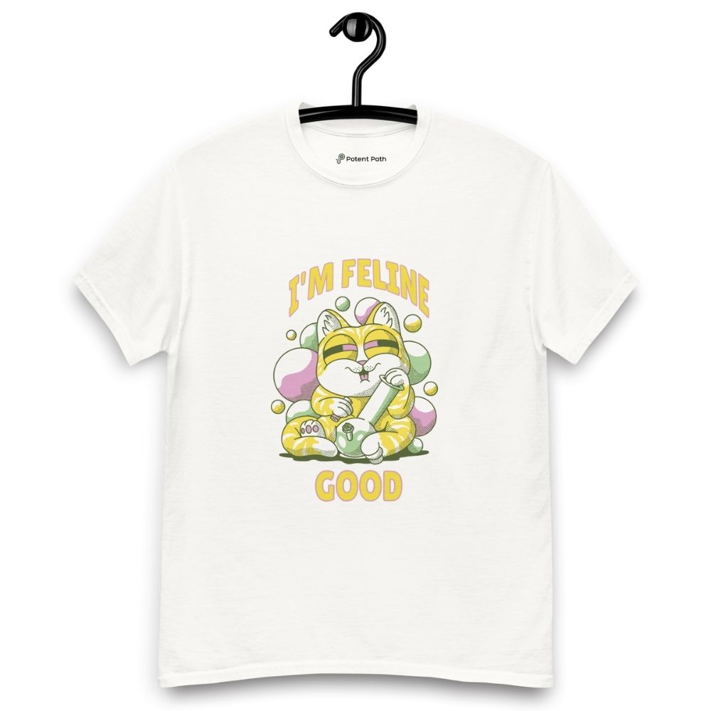 White T-shirt on a hanger featuring a cute cartoon cat holding a large bong, surrounded by colourful bubbles, and the text “I'M FELINE GOOD" printed above and below the illustration