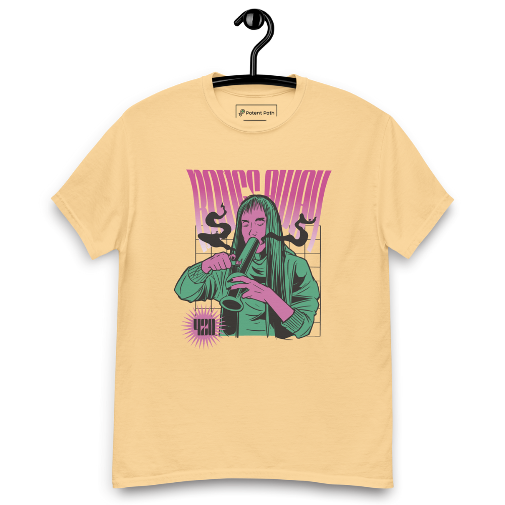 Light yellow T-shirt on a hanger featuring a stylised illustration of a woman with long hair lighting a bong, and the text "BONGS AWAY" distorted above her, along with a small "420" emblem at the bottom left