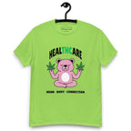 Lime green T-shirt on a hanger featuring a pink cartoon bear sitting in a meditative pose and holding two cannabis leaves, with the word "HEALTHCARE" above, with the words "THC" highlighted in green and the phrase "MIND, BODY, CONNECTION" below