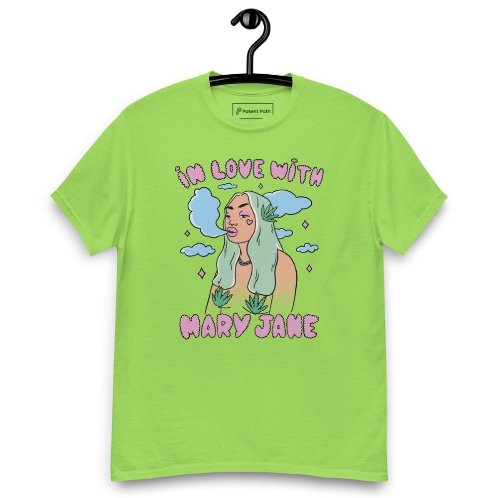 Lime Green T-shirt on a hanger featuring a cartoon woman with long green hair, cannabis leaves covering her breasts and smoke clouds behind her, with the text "IN LOVE WITH MARY JANE" above and "MARY JANE" below the illustration