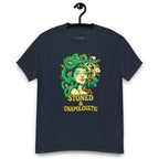 Navy blue T-shirt on a hanger featuring a Medusa head smoking a joint with green snake hair, and the text "STONED & UNAPOLOGETIC" below
