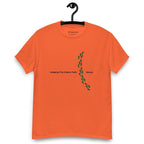 Orange t-shirt on a hanger featuring the phrase "Walking The Potent Path Slowly" in white text across the chest, with a vertical trail of small green footprints with cannabis leaves inside between "Path" and "Slowly"