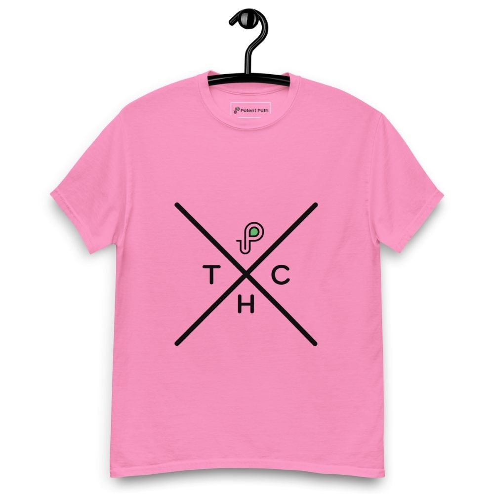 Pink t-shirt on a hanger featuring a minimalist crossed-line design with the letters T, H, C, arranged in the quadrants, and a small green-and-black "P" logo positioned above the centre of the cross