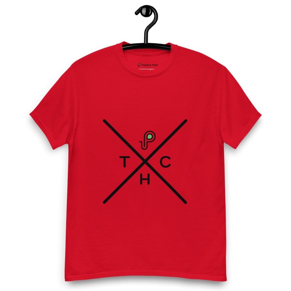 Red t-shirt on a hanger featuring a minimalist crossed-line design with the letters T, H, C, arranged in the quadrants, and a small green-and-black "P" logo positioned above the centre of the cross