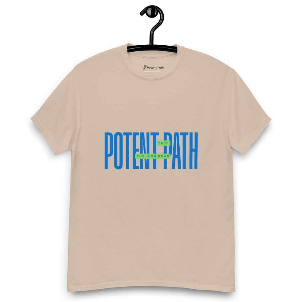 Sandy colour t-shirt on a hanger featuring large blue text that reads "POTENT PATH," with a small green overlay in the centre containing the words "TAKE THE HIGH ROAD"
