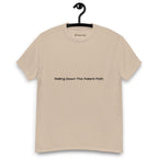 Sandy colour t-shirt on a hanger, featuring centred black text that reads 'Rolling Down The Potent Path'