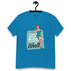 Sapphire blue T-shirt on a hanger featuring a retro-style illustration of a woman in a teal dress holding a smoking joint, next to the text “TODAY'S GOOD MOOD IS SPONSORED BY Weed"