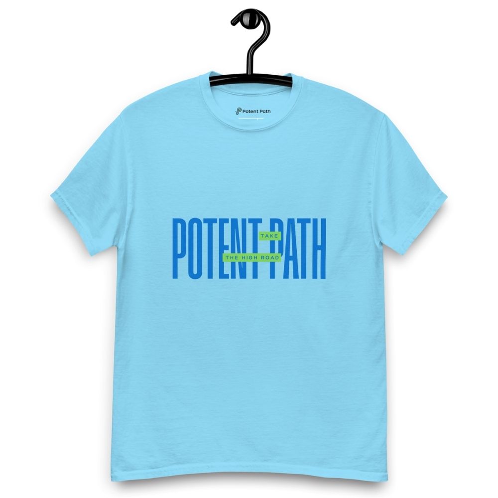 Sky blue t-shirt on a hanger featuring large blue text that reads "POTENT PATH," with a small green overlay in the centre containing the words "TAKE THE HIGH ROAD"